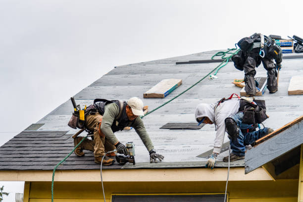 Professional Gutter Installation technician working in Amherst, MA